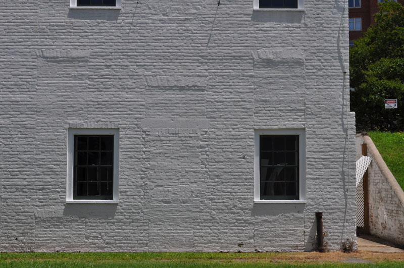  Officer's Quarters old doors windows can be seen in building wall.   Fort Norfolk, Norfolk VA - Photo by Steven Forrest