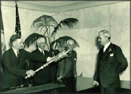 Norfolk Mayor W. R. L. Taylor (left) presents the historic Norfolk Mace to Virginia Governor James H. Price